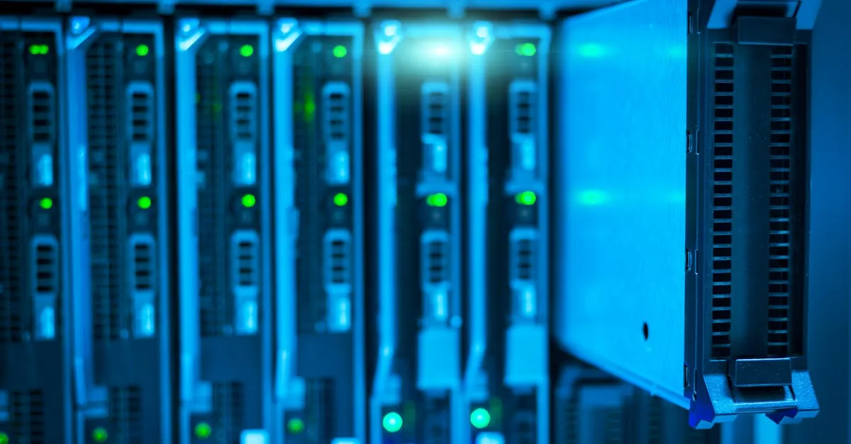 Rows of servers with status lights in a data centre